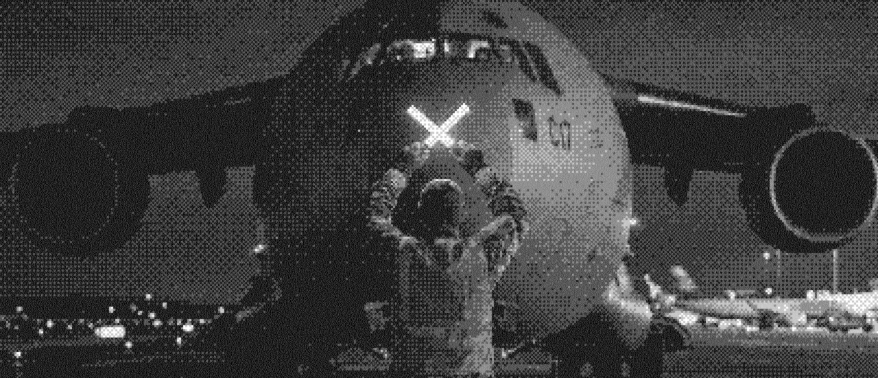 A high-contrast halftone photograph of a large cargo jet aircraft at night, viewed head-on